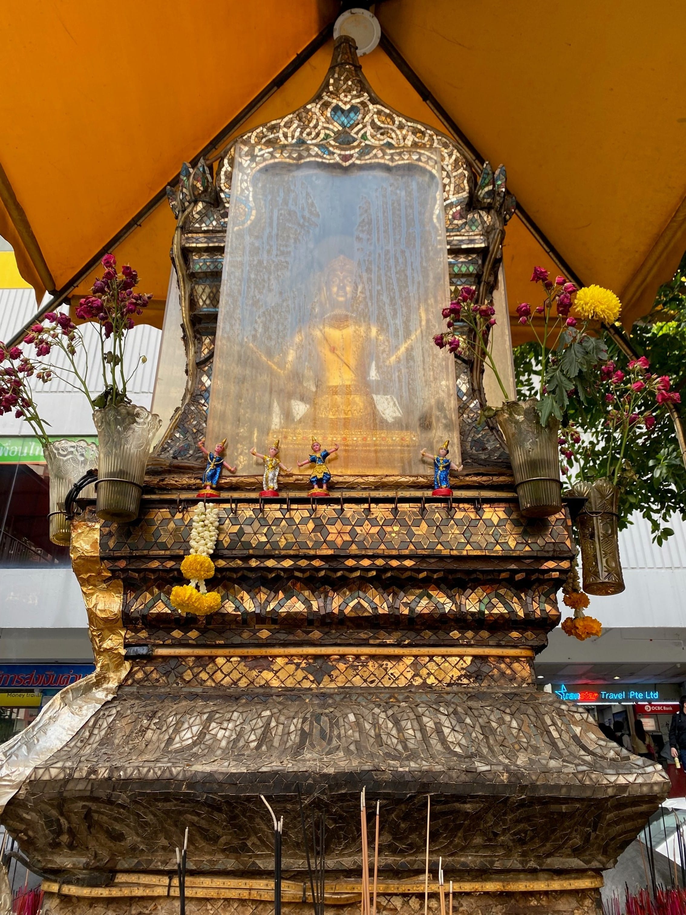 A close-up of the statue of Phra Phrom, or four-faced Brahma, 2022. In Thailand, the god is prayed to for good fortune and protection. This statue is mistakenly referred to as four-faced Buddha in Singapore.